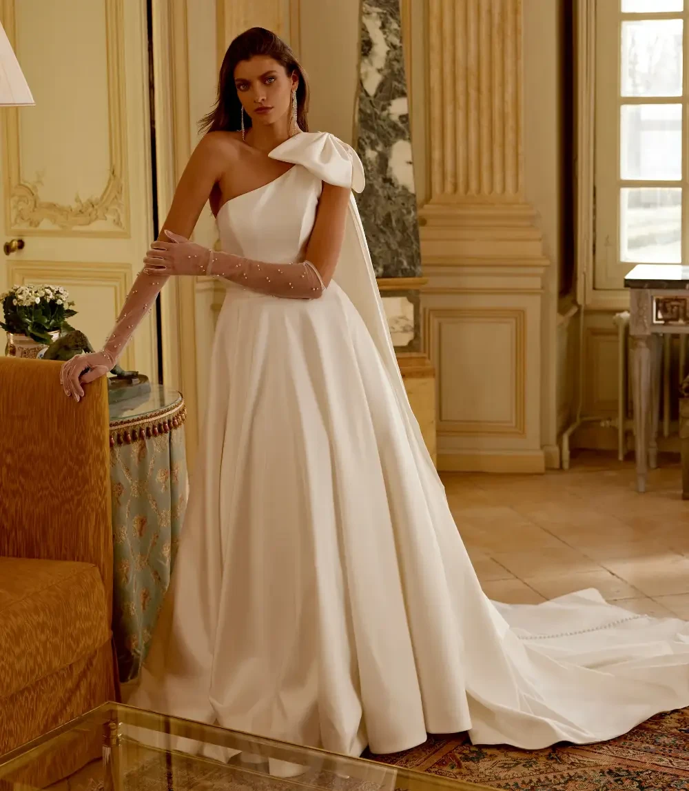 Model wearing a gown by Justin Alexander