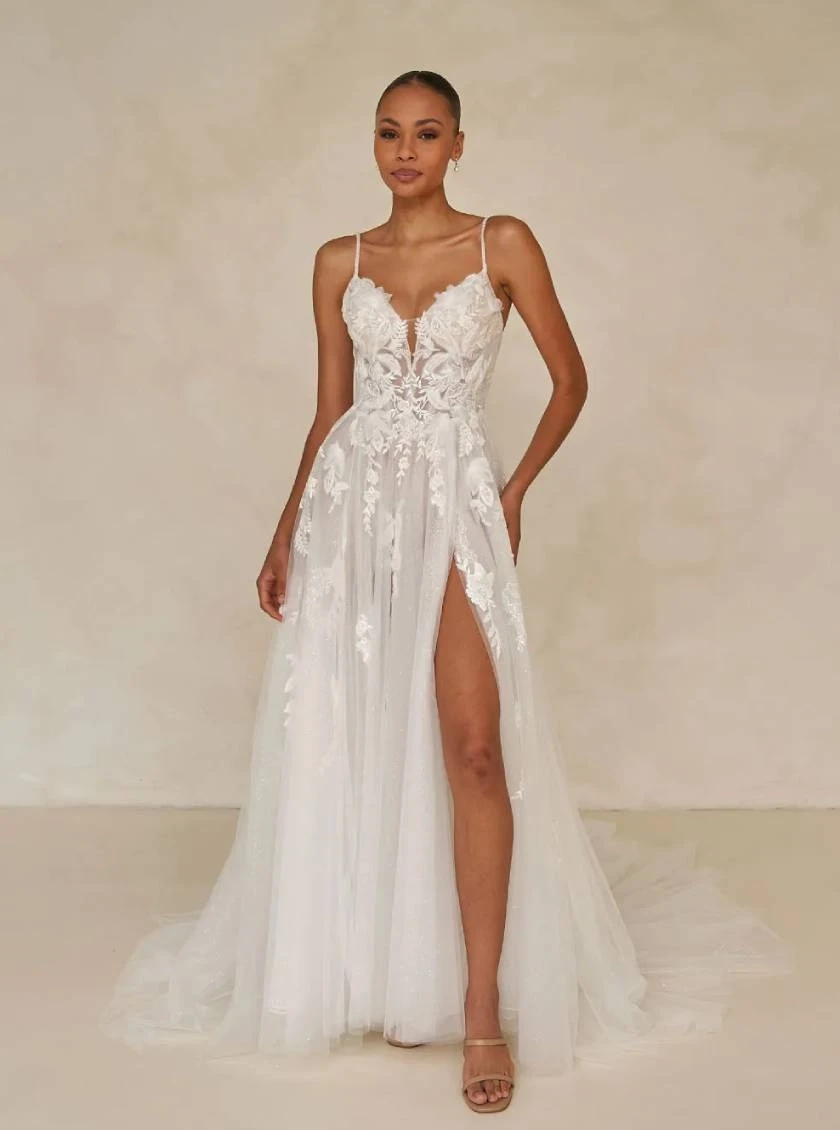 Model wearing a gown by Madi Lane