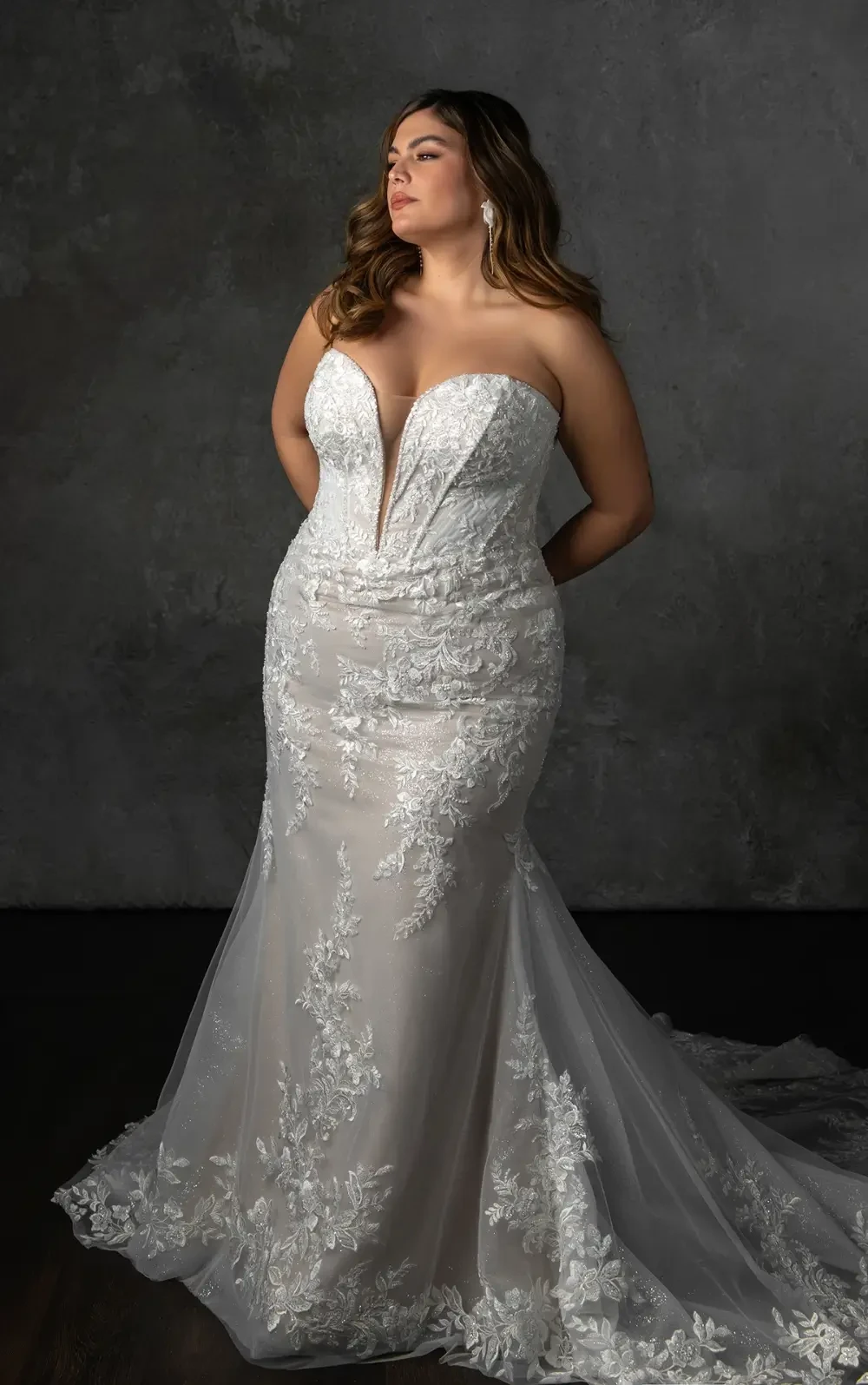 Model wearing a plus size dress