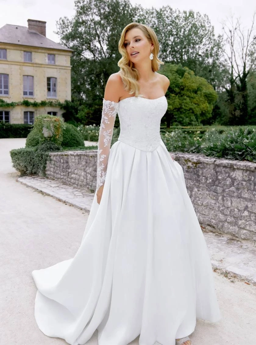 Model wearing a gown by Justin Alexander Sincerity